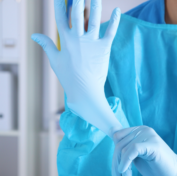 putting on latex gloves in medical lab