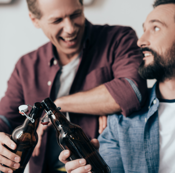 two happy men drinking beer