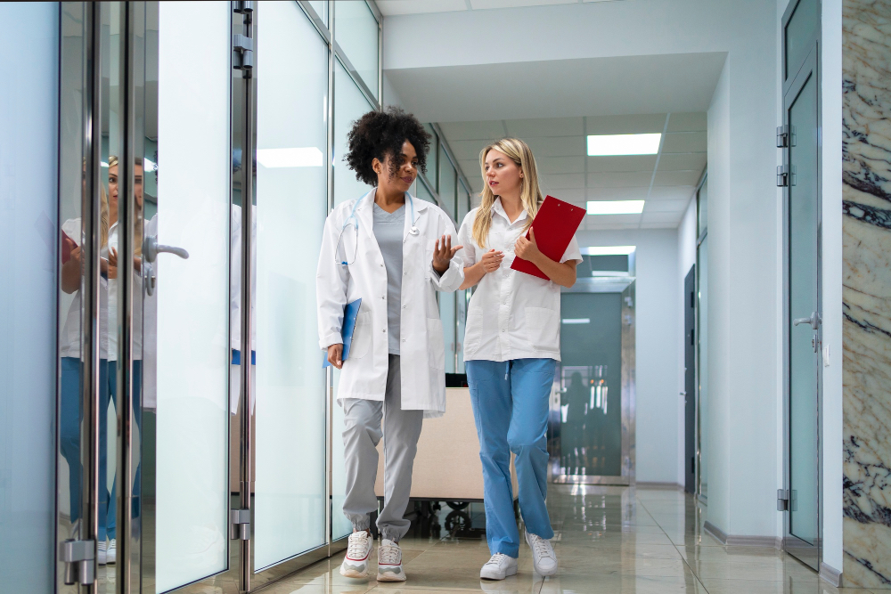Medical team standing in a bright hospital hallway, representing professional lab testing services in Germantown, Maryland