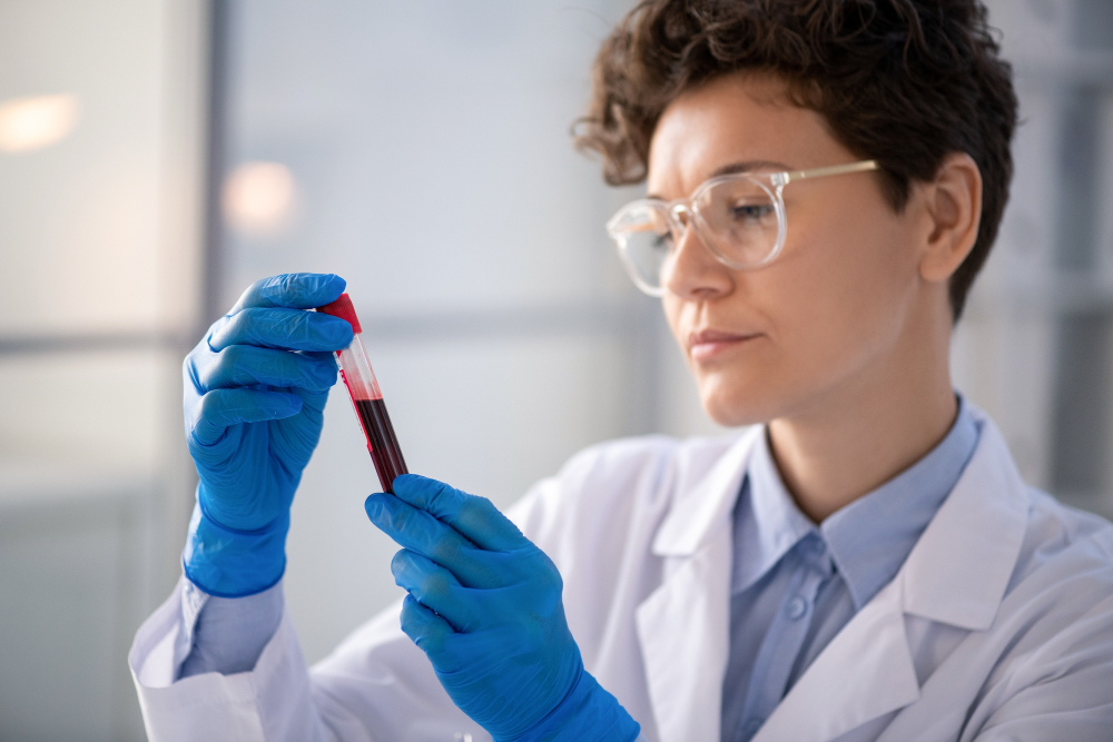 phlebotomist drawing blood for annual blood work at lab testing center